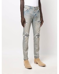 hellblaue enge Jeans mit Destroyed-Effekten von Amiri