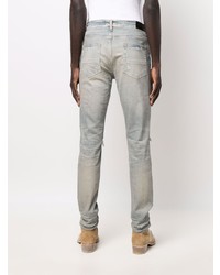 hellblaue enge Jeans mit Destroyed-Effekten von Amiri