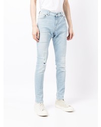 hellblaue enge Jeans mit Destroyed-Effekten von 7 For All Mankind