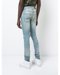 hellblaue enge Jeans mit Destroyed-Effekten von Amiri