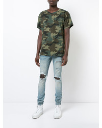 hellblaue enge Jeans mit Destroyed-Effekten von Amiri