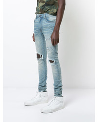 hellblaue enge Jeans mit Destroyed-Effekten von Amiri