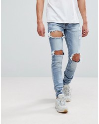 hellblaue enge Jeans mit Destroyed-Effekten von Sixth June