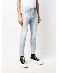 hellblaue enge Jeans mit Destroyed-Effekten von Philipp Plein