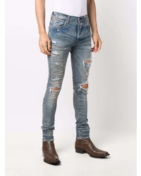 hellblaue enge Jeans mit Destroyed-Effekten von Amiri