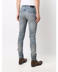 hellblaue enge Jeans mit Destroyed-Effekten von Amiri