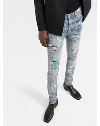 hellblaue enge Jeans mit Destroyed-Effekten von Amiri