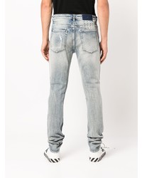 hellblaue enge Jeans mit Destroyed-Effekten von Ksubi