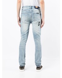 hellblaue enge Jeans mit Destroyed-Effekten von Ksubi