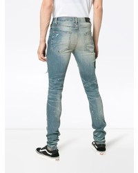 hellblaue enge Jeans mit Destroyed-Effekten von Amiri