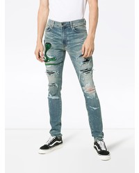 hellblaue enge Jeans mit Destroyed-Effekten von Amiri