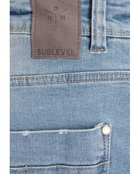 hellblaue enge Jeans mit Destroyed-Effekten von Sublevel