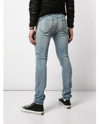 hellblaue enge Jeans mit Destroyed-Effekten von RtA