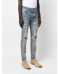 hellblaue enge Jeans mit Destroyed-Effekten von Amiri