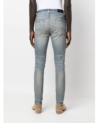 hellblaue enge Jeans mit Destroyed-Effekten von Amiri