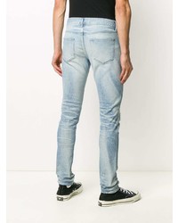 hellblaue enge Jeans mit Destroyed-Effekten von John Elliott