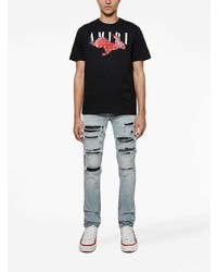 hellblaue enge Jeans mit Destroyed-Effekten von Amiri