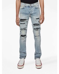 hellblaue enge Jeans mit Destroyed-Effekten von Amiri