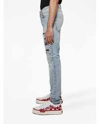 hellblaue enge Jeans mit Destroyed-Effekten von Amiri