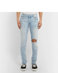 hellblaue enge Jeans mit Destroyed-Effekten von Amiri