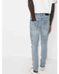 hellblaue enge Jeans mit Destroyed-Effekten von Ksubi
