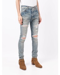 hellblaue enge Jeans mit Destroyed-Effekten von Amiri