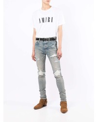 hellblaue enge Jeans mit Destroyed-Effekten von Amiri