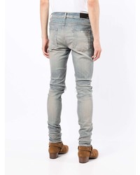 hellblaue enge Jeans mit Destroyed-Effekten von Amiri