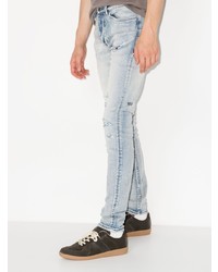 hellblaue enge Jeans mit Destroyed-Effekten von Ksubi