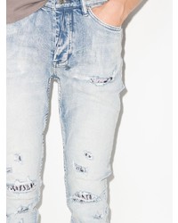 hellblaue enge Jeans mit Destroyed-Effekten von Ksubi