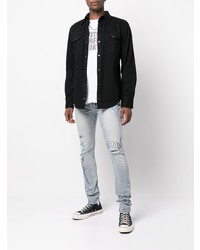 hellblaue enge Jeans mit Destroyed-Effekten von Ksubi