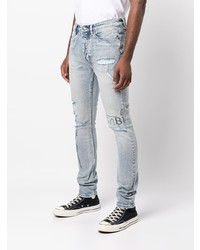 hellblaue enge Jeans mit Destroyed-Effekten von Ksubi