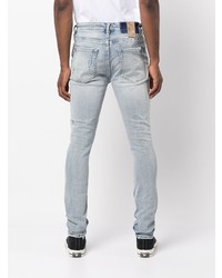 hellblaue enge Jeans mit Destroyed-Effekten von Ksubi