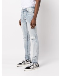 hellblaue enge Jeans mit Destroyed-Effekten von Ksubi