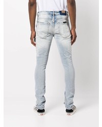 hellblaue enge Jeans mit Destroyed-Effekten von Ksubi