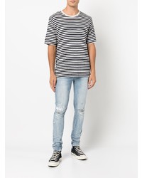 hellblaue enge Jeans mit Destroyed-Effekten von Ksubi