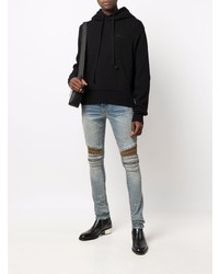 hellblaue enge Jeans mit Destroyed-Effekten von Amiri