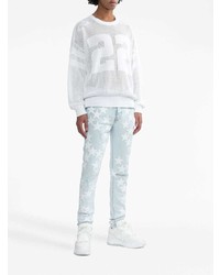 hellblaue enge Jeans mit Destroyed-Effekten von Amiri