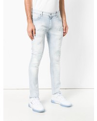 hellblaue enge Jeans mit Destroyed-Effekten von Tommy Hilfiger