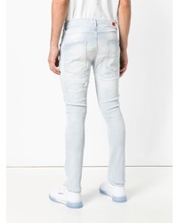 hellblaue enge Jeans mit Destroyed-Effekten von Tommy Hilfiger