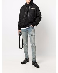 hellblaue enge Jeans mit Destroyed-Effekten von Amiri