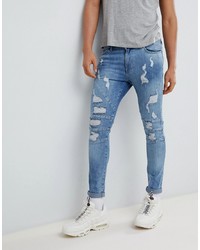 hellblaue enge Jeans mit Destroyed-Effekten von YOURTURN