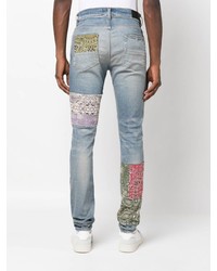 hellblaue enge Jeans mit Flicken von Amiri