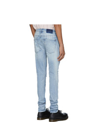 hellblaue Jeans mit Destroyed-Effekten von Ksubi