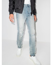 hellblaue Jeans mit Destroyed-Effekten von Ksubi