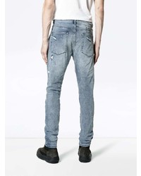 hellblaue Jeans mit Destroyed-Effekten von Ksubi