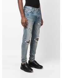 hellblaue Jeans mit Destroyed-Effekten von Amiri