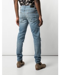 hellblaue Jeans mit Destroyed-Effekten von Amiri