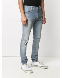 hellblaue Jeans mit Destroyed-Effekten von Balmain