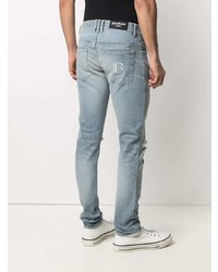 hellblaue Jeans mit Destroyed-Effekten von Balmain